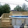 pressure treated deck by pool.
with steps wrapping around side.